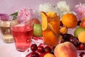 Apricot and cherry juice, apricots, cherries and grapes on a sunny table Royalty Free Stock Photo