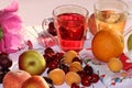 Apricot and cherry juice, apricots, cherries and grapes on a sunny table Royalty Free Stock Photo