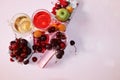 Apricot and cherry juice, apricots, cherries and grapes on a sunny table, top view, selective focus Royalty Free Stock Photo