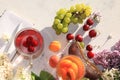 Apricot and cherry juice, apricots, cherries and grapes on a sunny table, top view, selective focus Royalty Free Stock Photo