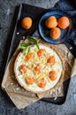 Apricot and cream cheese tart topped with almond flakes and crumble Royalty Free Stock Photo