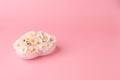 Apricot flowers on heart-shaped white calcite plate on a soft pink background, with copy space Royalty Free Stock Photo