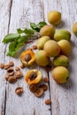 Apricot fruit. Fresh organic apricots on a white wooden background Royalty Free Stock Photo