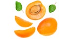 apricot fruits with slices and green leaf isolated on white background. top view. flat lay Royalty Free Stock Photo