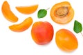 apricot fruits with slices and green leaf isolated on white background. top view. flat lay Royalty Free Stock Photo