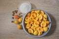 Apricot halves in a bowl, preparation for making preserves or jam Royalty Free Stock Photo