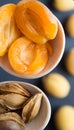 Apricot halves and kernels in wooden spoons. Top view