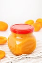 Apricot jam in glass jar. Homemade orange marmalade or jelly on white background Royalty Free Stock Photo