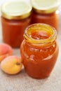 Apricot jam in glass jars on a table Royalty Free Stock Photo