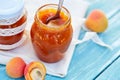 Apricot jam in glass jars on table Royalty Free Stock Photo