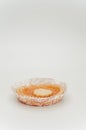 apricot jam pie in a paper backing cup on a white background Royalty Free Stock Photo