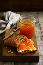 Apricot jam sandwich sunflower seeds on cutting board Royalty Free Stock Photo