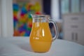 Apricot juice in a glass cup next to fresh apricots on a brown white background .1 cup freshly squeezed orange juice . Fresh Royalty Free Stock Photo