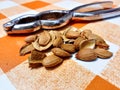 Apricot kernels on tablecloth with cracker Royalty Free Stock Photo