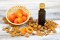 Apricot oil from apricot kernels in a brown bottle Royalty Free Stock Photo