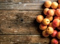 Apricot. Organic fruits with leaf on wooden background