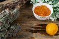 Apricot and peach jam in a small deep dish, sweet orange jam for dessert. Next to a whole fruit, apricots are marinated in syrup. Royalty Free Stock Photo