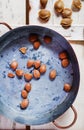 Apricot pits in a copper pot Royalty Free Stock Photo