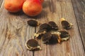 Apricot stones on wooden table