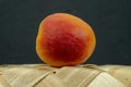 Apricot on a tipped wicker basket