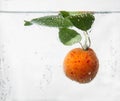 Apricot in water with bubbles Royalty Free Stock Photo