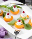 Apricote with cream and cranberry Royalty Free Stock Photo