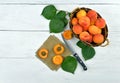 Apricots in a basket on a wooden background. Rustic style. Royalty Free Stock Photo