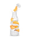 Apricots with a bottle made from milk splashes