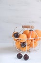 Apricots and cherries in metal basket Summer fruit and berries c Royalty Free Stock Photo