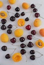 Apricots and cherries on white backgroud Summer fruit a Royalty Free Stock Photo