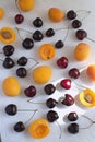 Apricots and cherries on white backgroud Summer fruit a Royalty Free Stock Photo