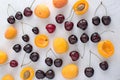 Apricots and cherries on white backgroud Summer fruit a Royalty Free Stock Photo