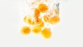 Apricots are falling in the clear water with splash Royalty Free Stock Photo