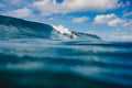 April 04, 2021. Bali, Indonesia. Sporty young woman in tropical ocean during surfing. Surfer girl on surfboard and perfect wave