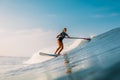 April 12, 2019. Bali, Indonesia. Stand Up Paddle surfer ride on ocean wave. Stand Up Paddle surfing at waves in Bali