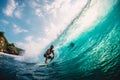 April 18, 2019. Bali, Indonesia. Surfer ride on barrel wave. Professional surfing at big waves in Padang Padang Royalty Free Stock Photo