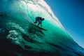 April 18, 2019. Bali, Indonesia. Surfer ride on barrel wave. Professional surfing at big waves in Padang Padang