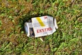 Svyturys, Ekstra can of beer on green grass. People throw food waste, leave trash on the street after