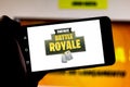 April 1, 2019, Brazil. Logo Fortnite Battle Royale on the screen of the mobile device. Fortnite is an online multiplayer online Royalty Free Stock Photo