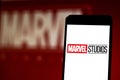 Marvel Studios logo on mobile device. Marvel Studios is an American film studio part of the conglomerate