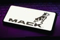 April 26, 2023, Brazil. In this photo illustration, the Mack Trucks logo is displayed on a smartphone screen