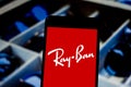 April 1, 2019, Brazil. Ray-Ban logo on the mobile device. Ray-Ban is a brand of sunglasses and eyewear of degree, based in Milan, Royalty Free Stock Photo