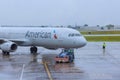 Plane of American Airlines is being pushed back on runway while preparing for flight Royalty Free Stock Photo