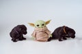 April, 2021: The Child, Grogu or baby Yoda, fictional character from the TV series The Mandalorian with black labrador Royalty Free Stock Photo