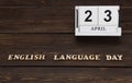 April 23, date on the calendar. English Language Day. Handmade wood cube with date month and day. english alphabet. Royalty Free Stock Photo