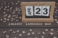 April 23, date on the calendar. English Language Day. Handmade wood cube with date month and day. english alphabet. Royalty Free Stock Photo