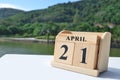 April 21, Date design with number cube on white table, cover design in the natural concept.