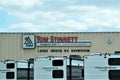 Tom Stinnett RV showroom sign on box store with Transcend campers