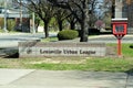 Louisville Urban League sidewalk sign on low wall