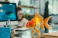 1 april fools day. Funny day. April fish. Prank. A goldfish toy on a busy office desk, contrasting the playful with the Royalty Free Stock Photo